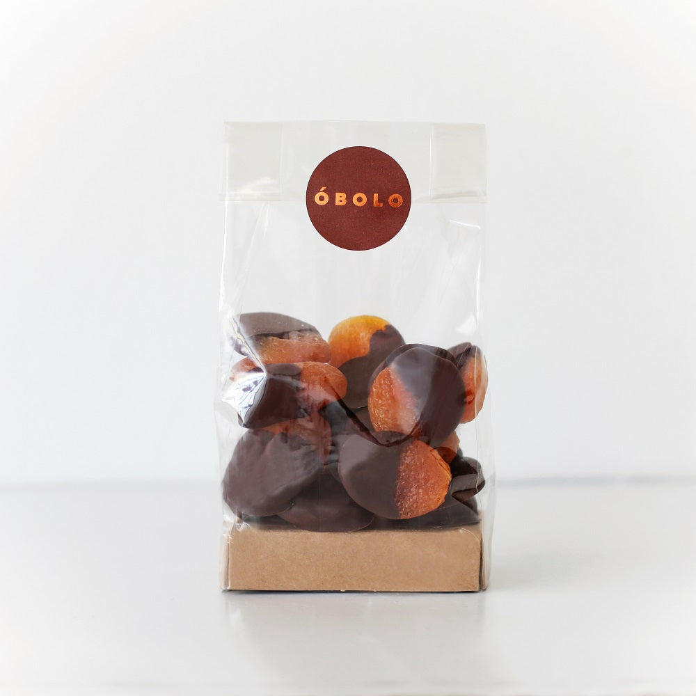 Damascos confitados bañados en chocolate negro envase compostable